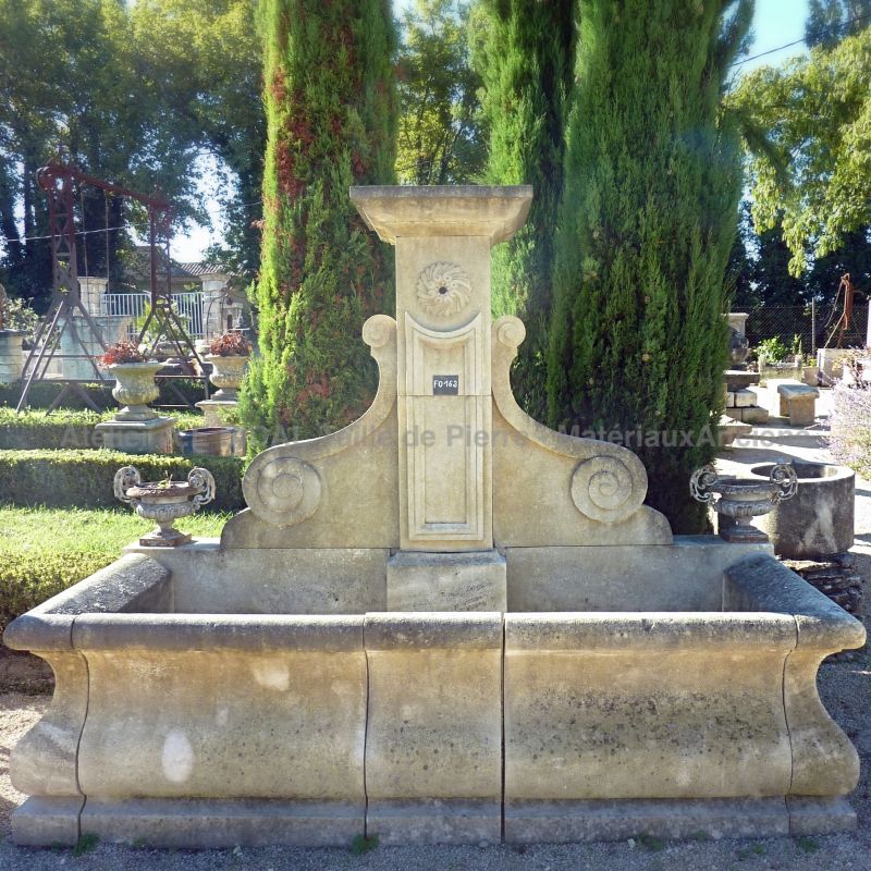 French garden wall fountain in natural limestone from the provencal Alain BIDAL.