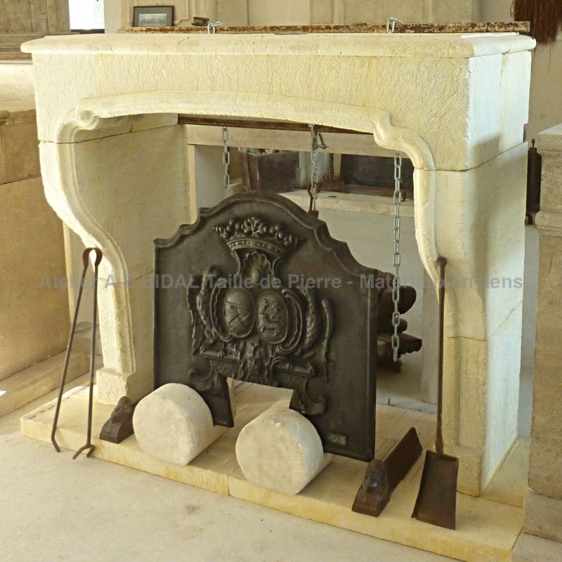 Louis XIII style fireplace in Estaillades stone, a natural limestone that can be found in the South of France.