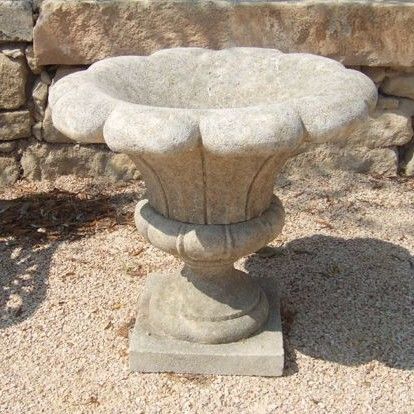 Natural limestone vase carved in the shape of a flower