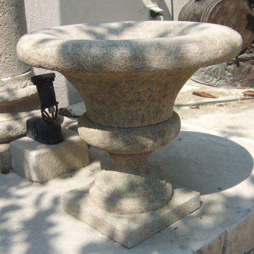 Large and flared vase in carved natural limestone