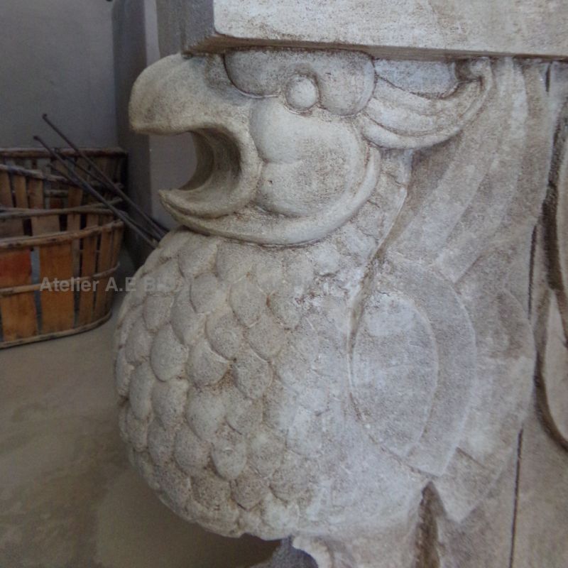 Hand-sculpted griffins in stone used as table legs - Atelier Alain BIDAL (Provence)