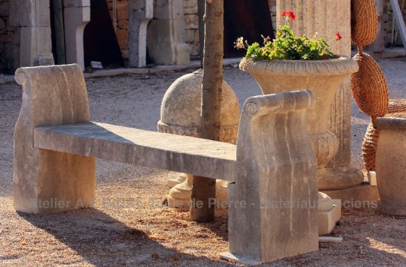 Stone bench with armrests of the Alain Bidal stone cutting workshops in Provence.
