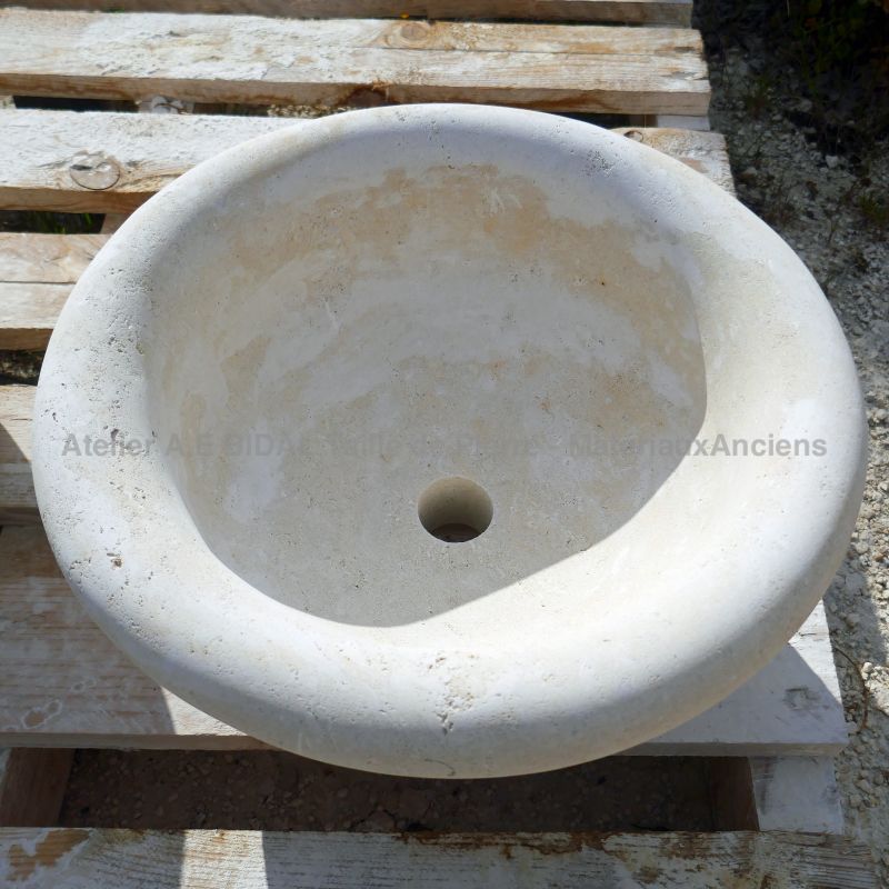 Natural stone washbasin : a small round stone sink for bathroom by the stonemason Alain BIDAL (Provence)